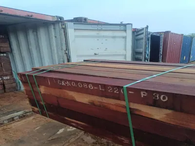 Sawn timber stacked outside the factory shed