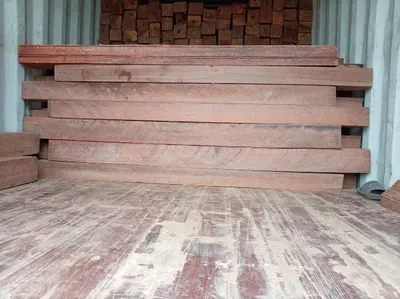 Sawn timber planks inside a container